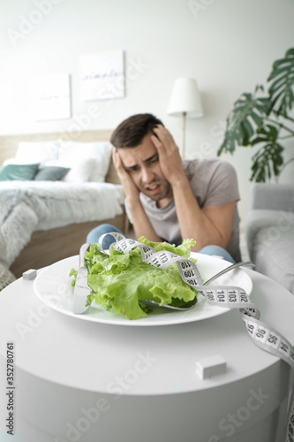 Young man suffering from an...