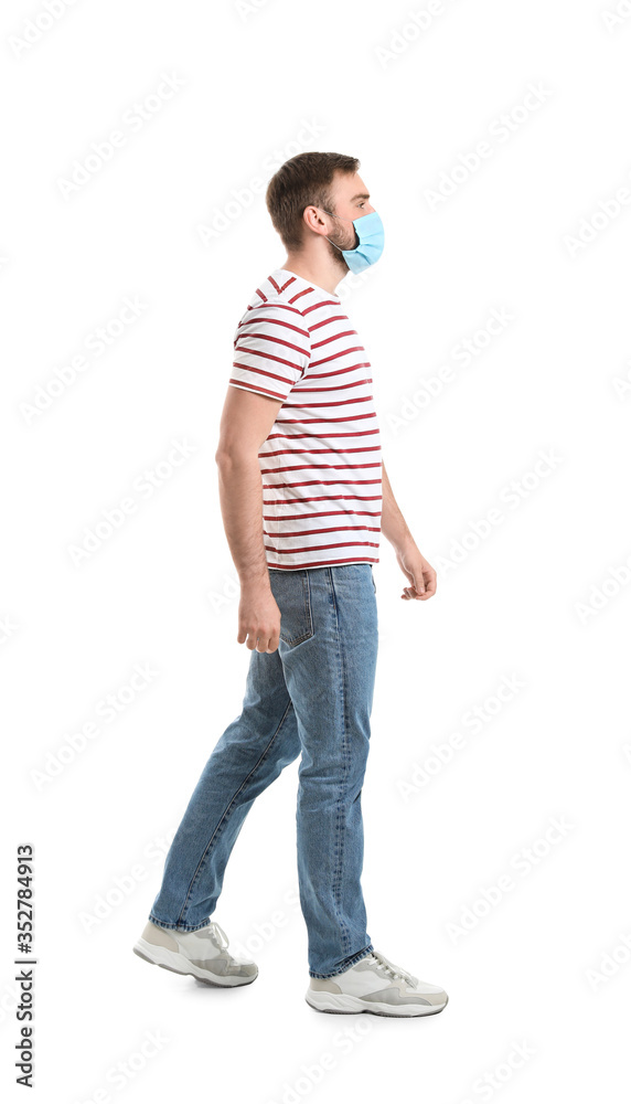 Young man wearing protective mask on white background. Concept of coronavirus epidemic Young man wearing protective mask on white background. Concept of coronavirus epidemic