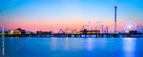 Galveston Island historic Pleasure Pier on the Gulf of Mexico coast in Texas. photo