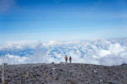 hiker on the top of mountain