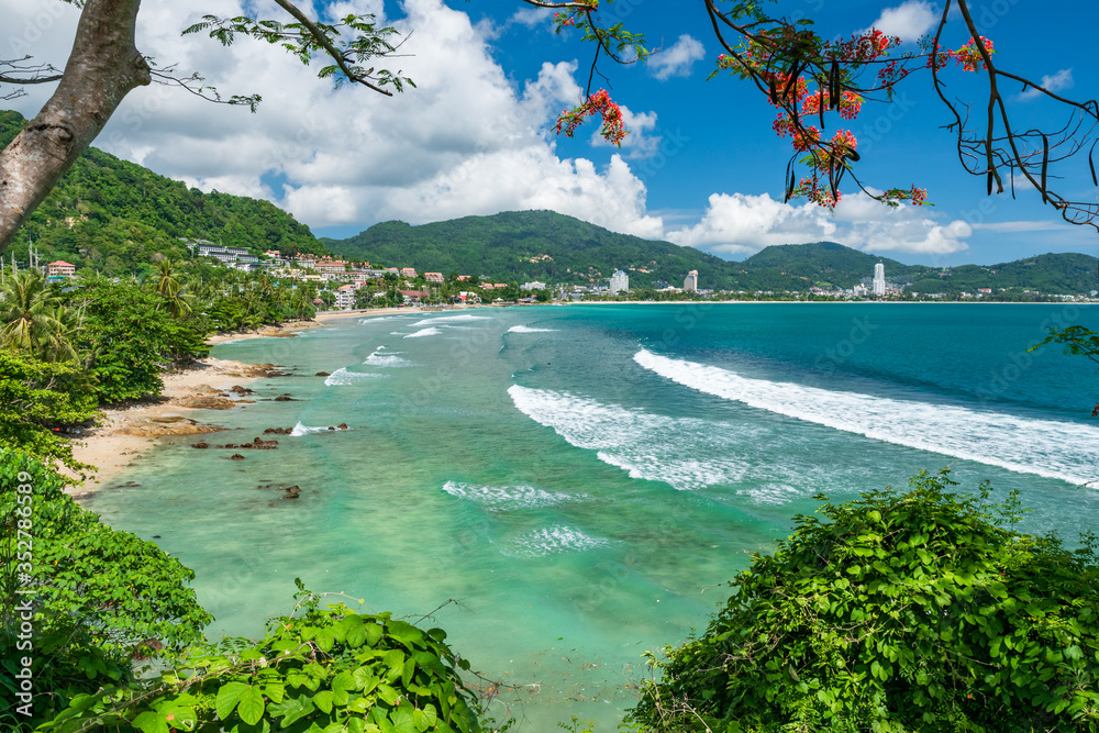 Beautiful view of quiet sunny day at famous Patong beach in Phuket Thailand during locked down policy due to Covid-19. All beaches in Phuket are not allowed to enter.