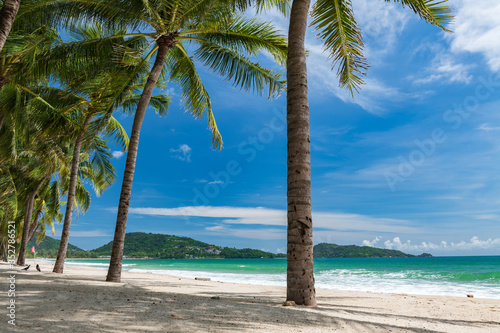 Beautiful view of quiet sunny day at famous Patong beach in Phuket Thailand during locked down policy due to Covid-19. All beaches in Phuket are not allowed to enter.