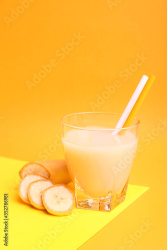 Banana juice in a glass with sliced bananas