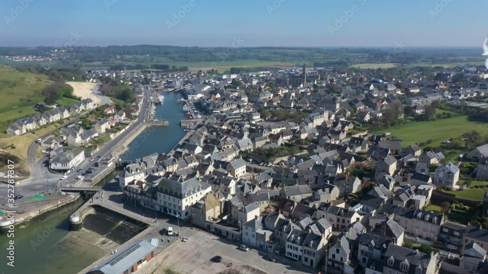 Aerial view of the city of Port-en-Bessin and its port. Port-en-Bessin is a commune in the Calvados department in the Basse-Normandie region in northwestern France. Aerial view of the city of Port-en-Bessin and its port. Port-en-Bessin is a commune in the Calvados department in the Basse-Normandie region in northwestern France.