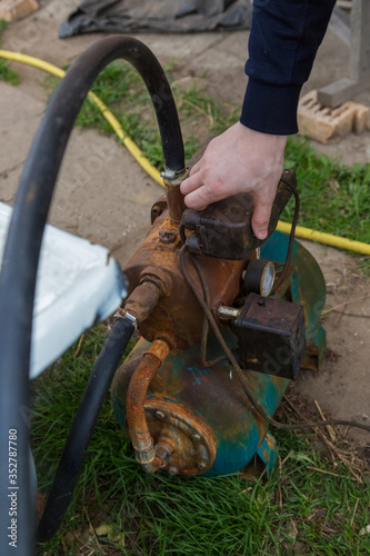 the old water pump in the garden  photo