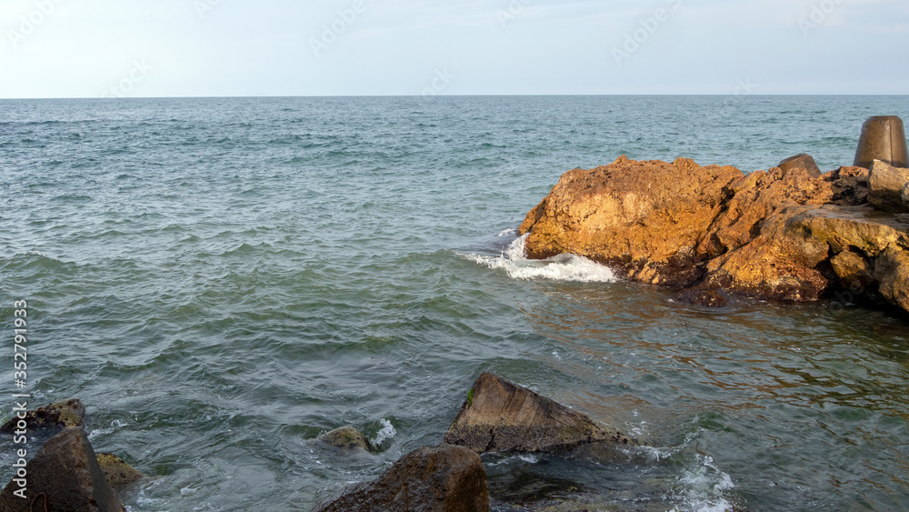 Small bay with rocks on the Black Sea in a late afternoon Small bay with rocks on the Black Sea in a late afternoon
