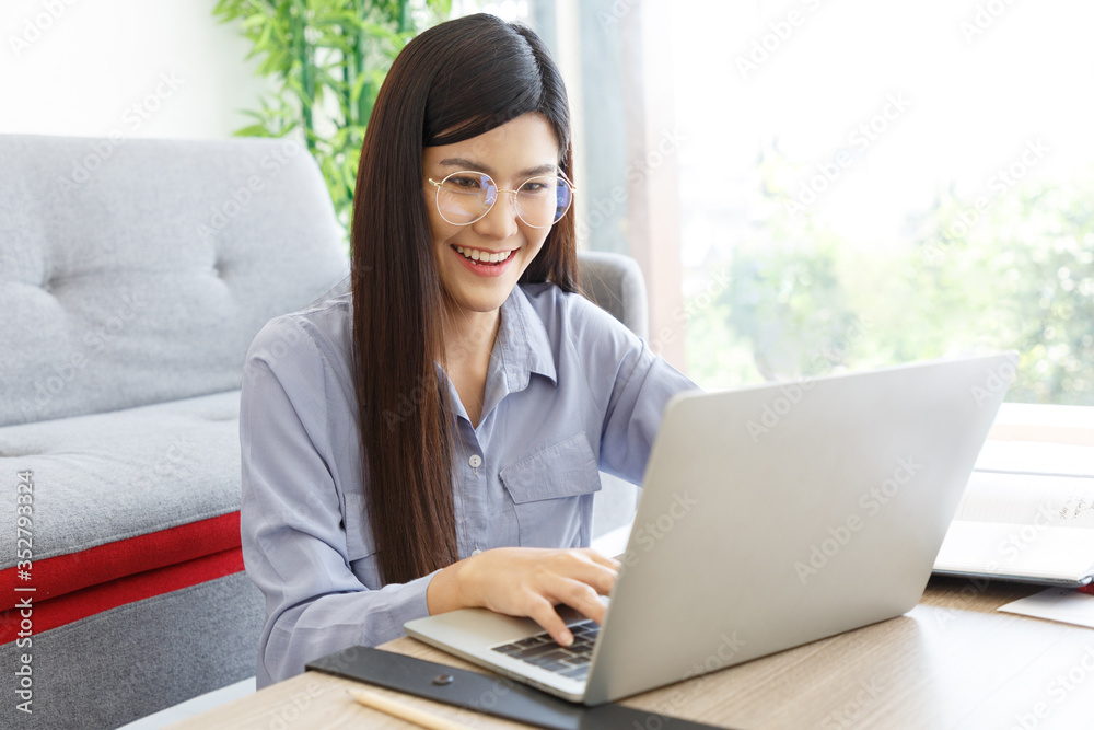 Young Cute Woman feels happy and Excited while video call Meeting on Work For Home Period. COVID-19 Lock Down. Copy Space. Young Cute Woman feels happy and Excited while video call Meeting on Work For Home Period. COVID-19 Lock Down. Copy Space.