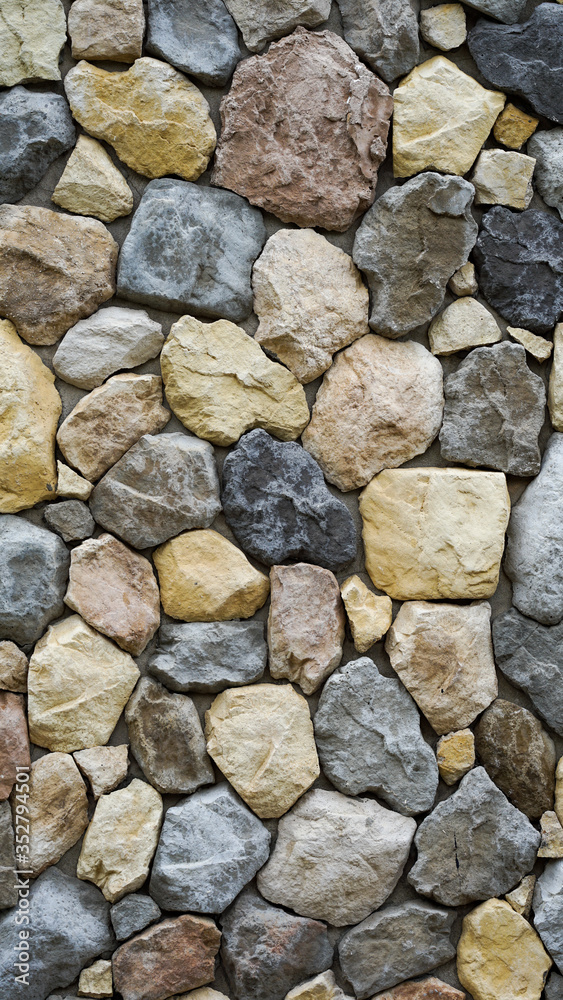 The walls made of many small stones were arranged artistically. Suitable for use as background images.