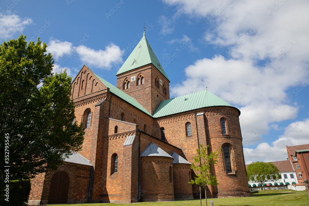 Sct bendts church i denmark woth blue sky and clouds