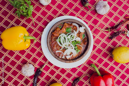 Georgian National Cuisine. Ostri is a hot, spicy beef stew that is very popular in Georgia photo