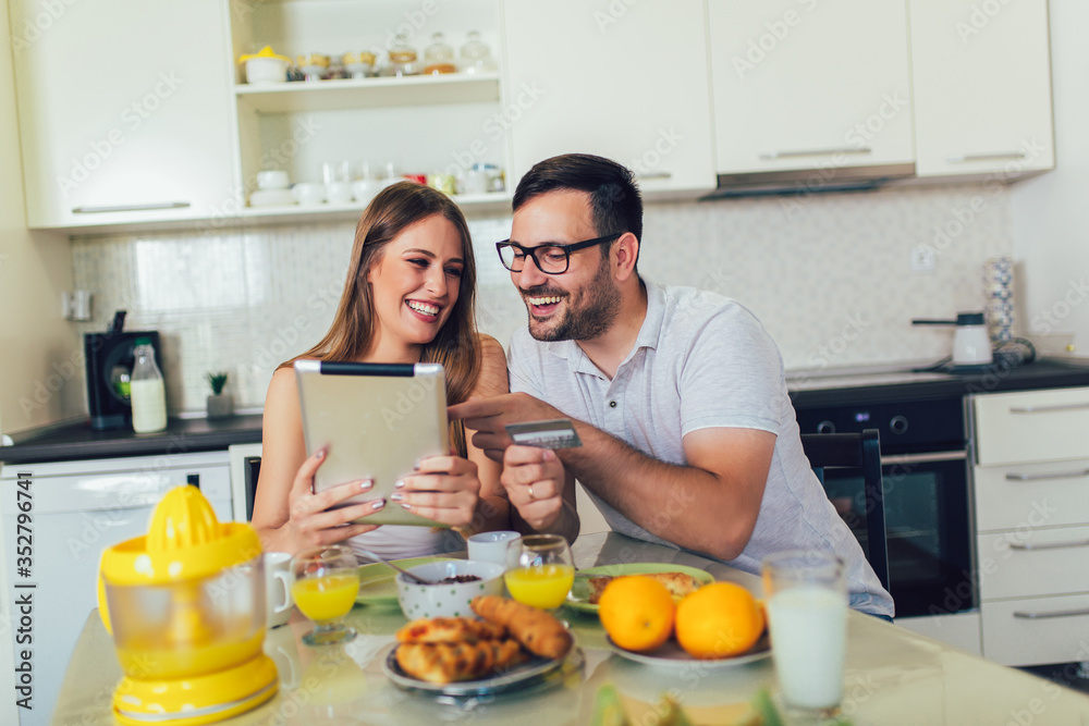 Couple spending money online on the internet. Couple spending money online on the internet.