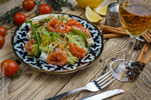 Salad from tomatoes, cucumber, red onions and lettuce leaves. healthy summer vitamin menu. vegan vegetable food. vegetarian dinner table. top view. flat lay