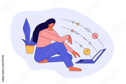 Young woman or girl sitting and working at laptop
