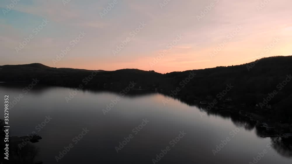 Colorful Sunset Over The Mountains And Lake Massawippi Near The Village Of North Hatley In Quebec, Canada. - aerial drone shot Colorful Sunset Over The Mountains And Lake Massawippi Near The Village Of North Hatley In Quebec, Canada. - aerial drone shot
