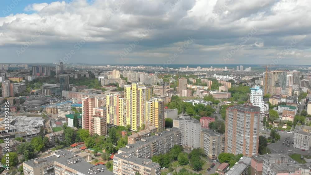 Metropolis aerial view clouds cityscape multistory houses apartment buildings left side drone movement Kyiv Ukraine Metropolis aerial view clouds cityscape multistory houses apartment buildings left side drone movement Kyiv Ukraine