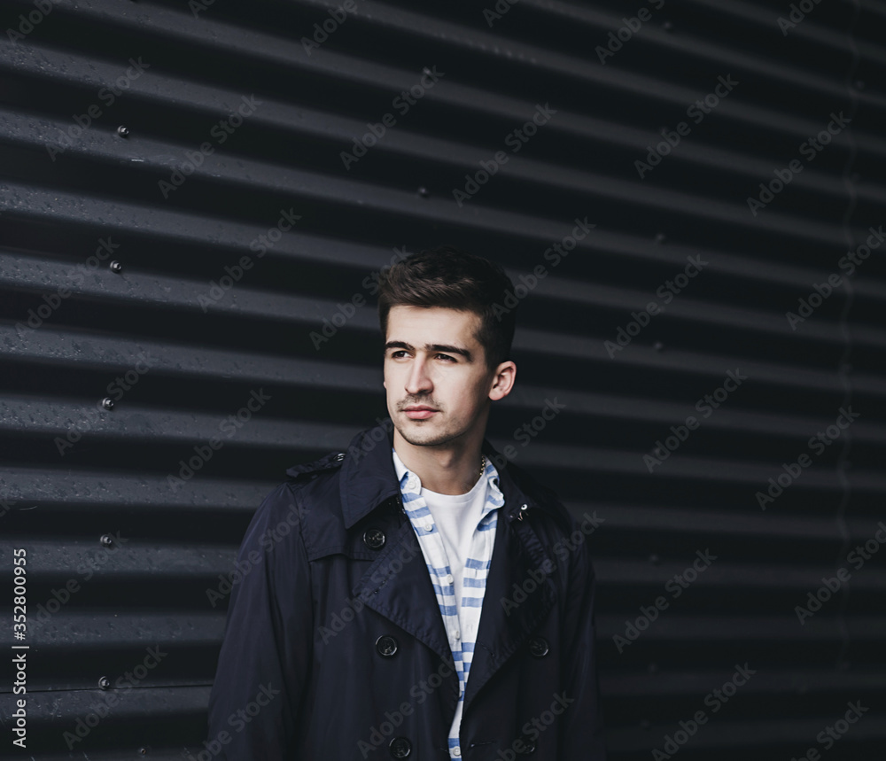 Fototapeta premium Portrait of a young handsome man wearing jacket