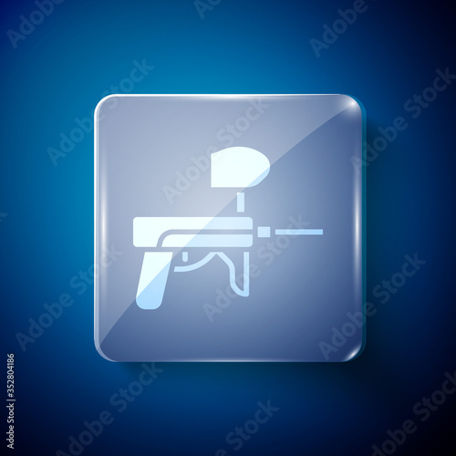 White Paintball gun icon isolated on blue background. Square glass panels. Vector Illustration