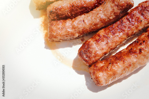 ready-made meat sausages chimpchichi lie on a white plate