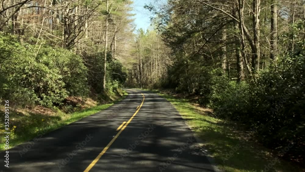 Traveling on empty countryside blue ridge parkway road and pavement, covid-19 pandemic, pov car passenger Traveling on empty countryside blue ridge parkway road and pavement, covid-19 pandemic, pov car passenger