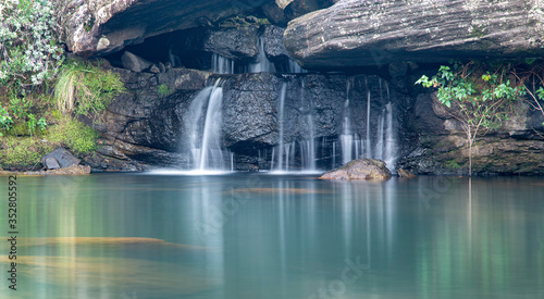 Secluded Waterfall in Drakensberg hiking trail morning shot