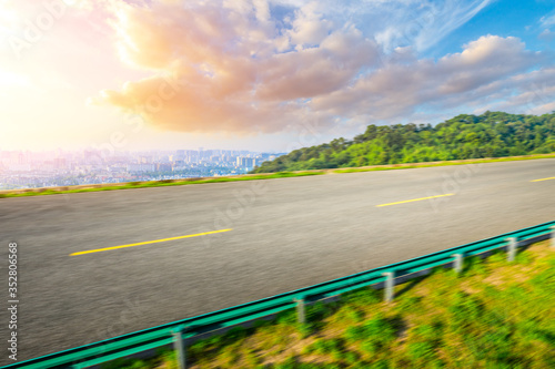 Motion blurred highway and city skyline in hangzhou. © ABCDstock