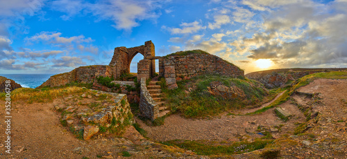 Konstfotografi Panoramic image of Grosnez Castle keep constructed circa 1330 and located in the North West corner of Jersey early morning with the sea in the background and blue skys
