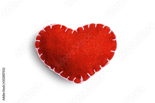 Vászonkép Handmade red heart made of felt stitched with white thread isolated on a white background