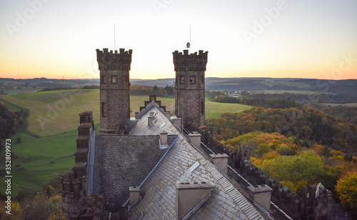 I made this photo from the tower of the vacant castle De Schaumburg in Balduinstein Germany.It was the fall in the fall.Beautiful rolling mountain landscape in the background.Order Castle in rolling c photo