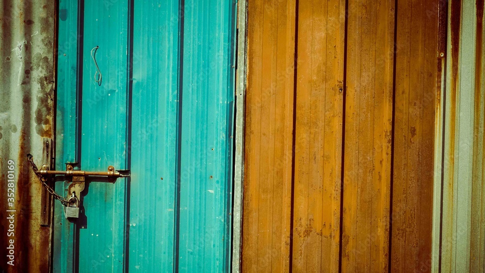 Blue and brown front of a door with lock