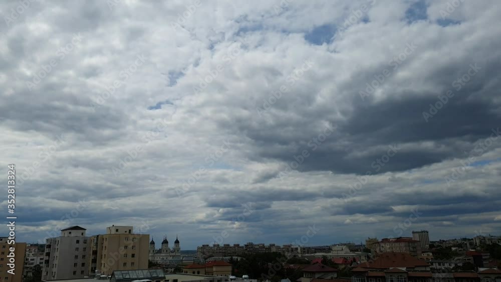 Particularly beautiful clouds over the city in Romania on a summer day Particularly beautiful clouds over the city in Romania on a summer day