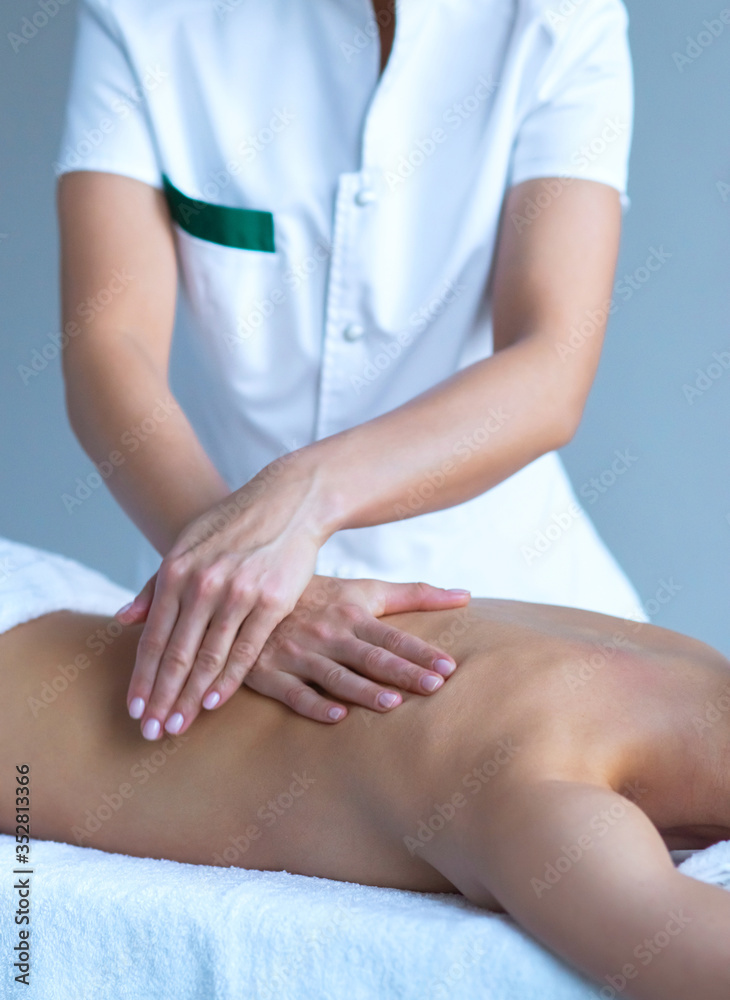 Fototapeta premium Close-up of traditional healing and recreation massaging treatments. Health, skin care, massage, osteopathy and manual therapy.
