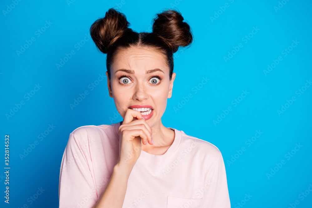 Close-up portrait of her she nice attractive lovely pretty worried terrified scared brown-haired girl biting finger phobia isolated on bright vivid shine vibrant blue color background Close-up portrait of her she nice attractive lovely pretty worried terrified scared brown-haired girl biting finger phobia isolated on bright vivid shine vibrant blue color background