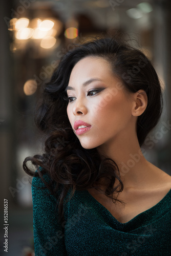 Portrait of beautiful asian woman in green dress