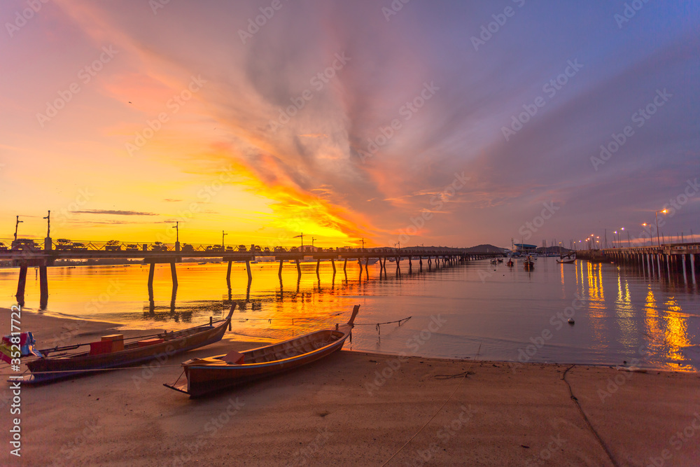 Fototapeta premium sunrise at Chalong pier. Chalong bay is the most important marina of Phuket there have 2 piers and customs at pier..