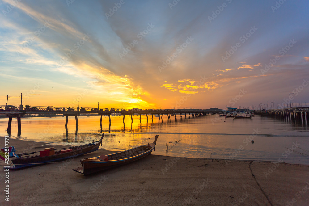Obraz premium sunrise at Chalong pier. Chalong bay is the most important marina of Phuket there have 2 piers and customs at pier..