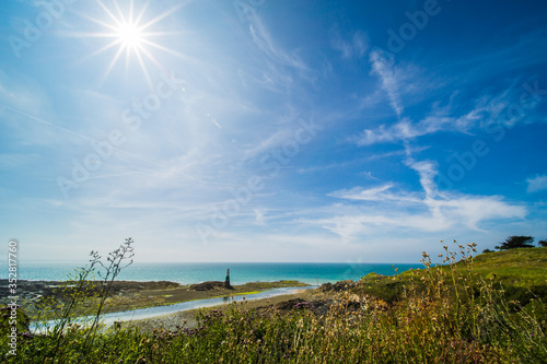 Pléneuf-Val-André Lighthouse with Turquoise Blue Atlantic Ocean on a Sunny Summer Day in Brittany France