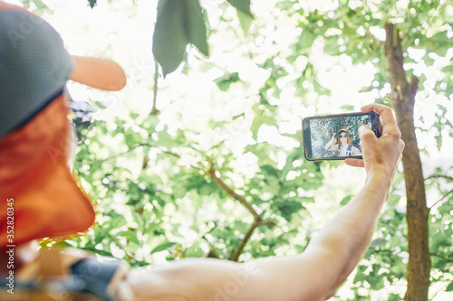 Woman taking a selfie in nature
