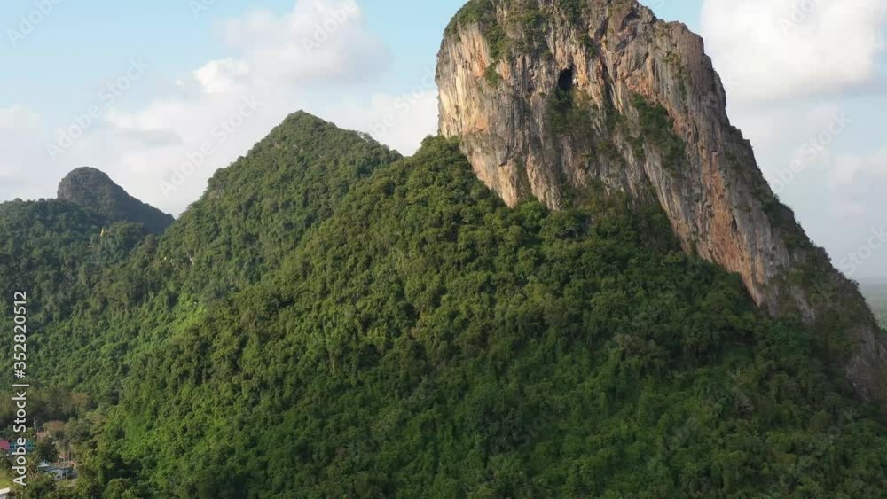 Khao Ok Talu mountain, the famous sightseeing 250 meters height symbolic mountain in Phatthalung Province, Thailand. Khao Ok Talu mountain, the famous sightseeing 250 meters height symbolic mountain in Phatthalung Province, Thailand.