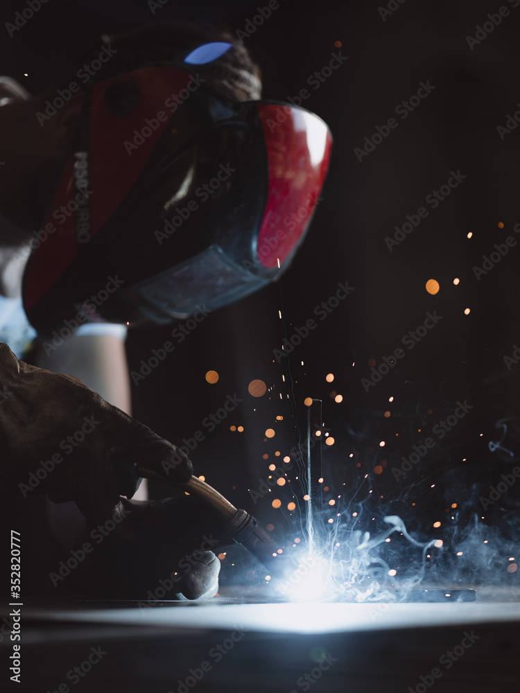Professional welder at work in his factory Professional welder at work in his factory