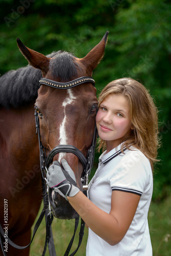 Beautiful young girl rider and her horse