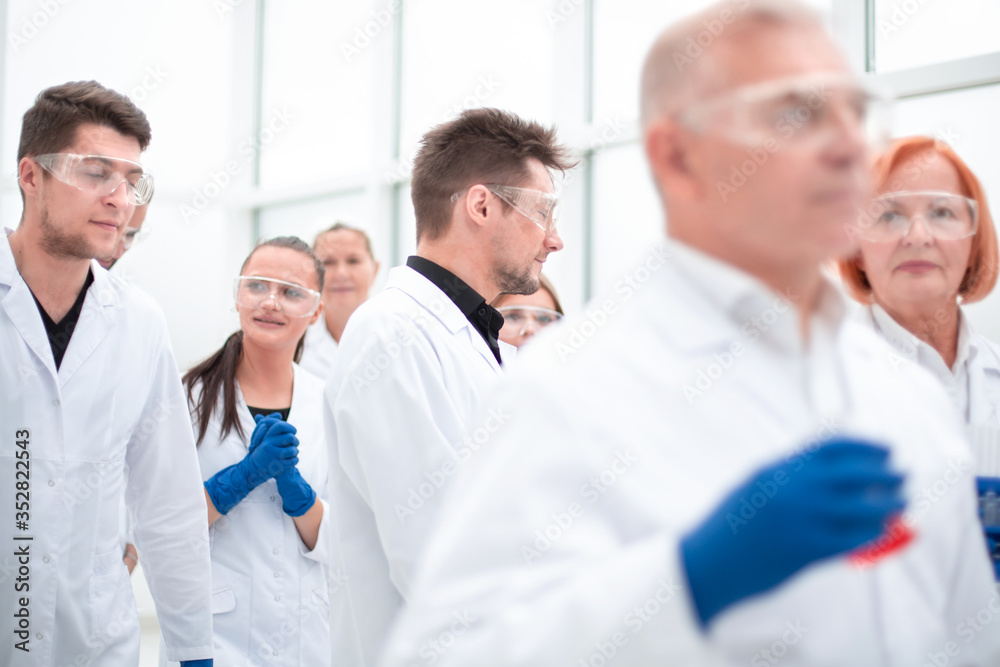 group of researchers working on a new vaccine. group of researchers working on a new vaccine.
