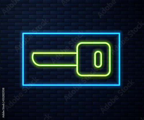Glowing neon line Key icon isolated on brick wall background. Vector Illustration
