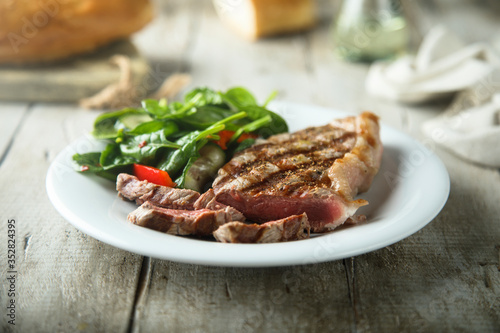 Grilled beef steak with salad