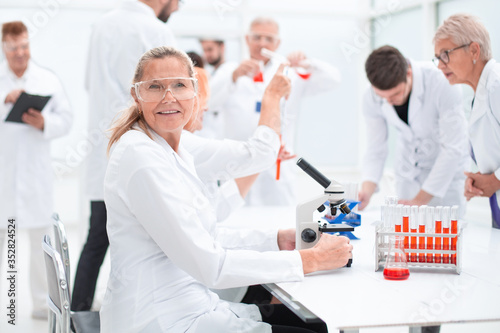 close up. senior female scientist sitting at a laboratory table.