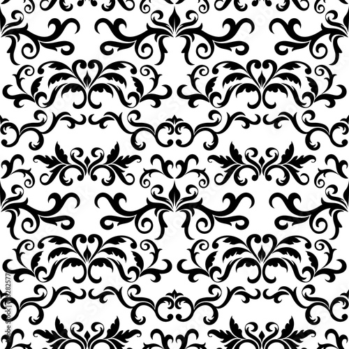 Seamless pattern with ornate Damask ornament on a white background. Design of curls and plant elements. Ideal for textile print and wallpapers.