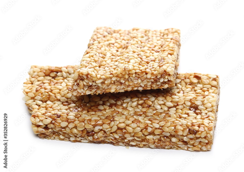 Granola muesli protein, energy bar with sesame seeds isolated on white background Granola muesli protein, energy bar with sesame seeds isolated on white background