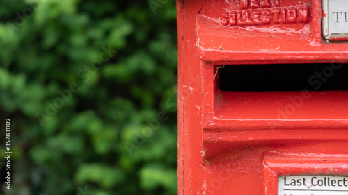 Canvas Print Red post box in a rural village
