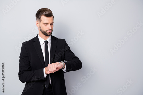 Portrait of serious successful worker stand copyspace wait for his partners check time wrist watch wear classy outfit isolated over grey color background