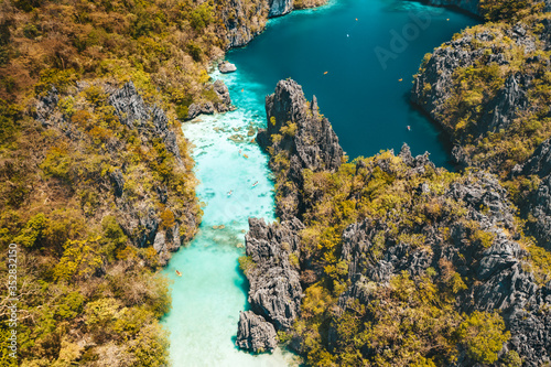 El Nido, Palawan, Philippines, aerial view of beautiful big lagoon, limestone cliffs and kayaking tourists