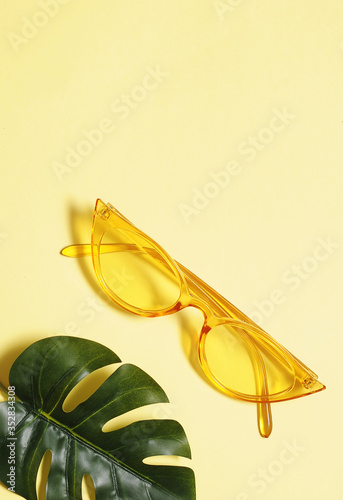 Stylish sunglasess on colorful background.